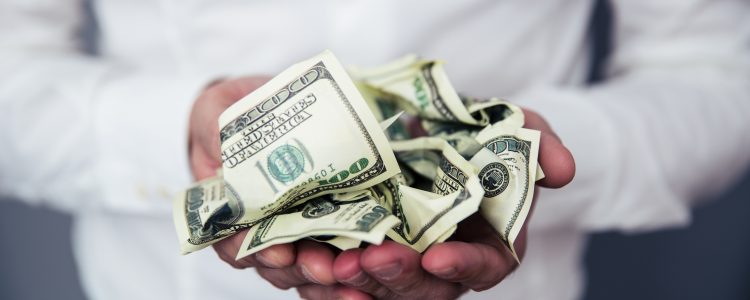 Business man hands holding money