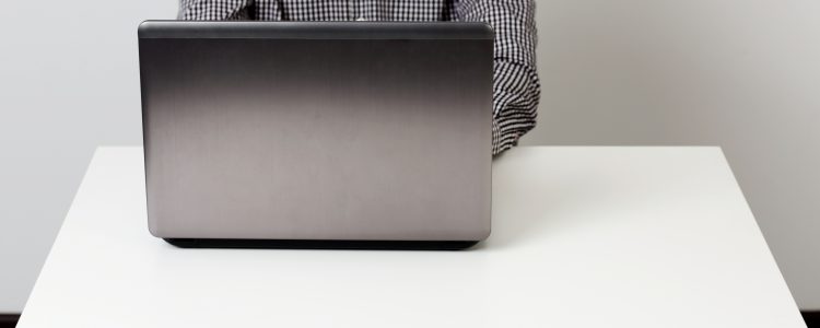 Closeup portrait of a businessman working on the laptop