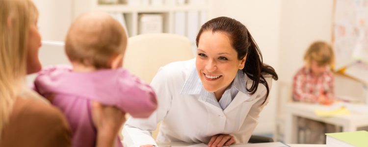 Visit at pediatrician mother with baby girl
