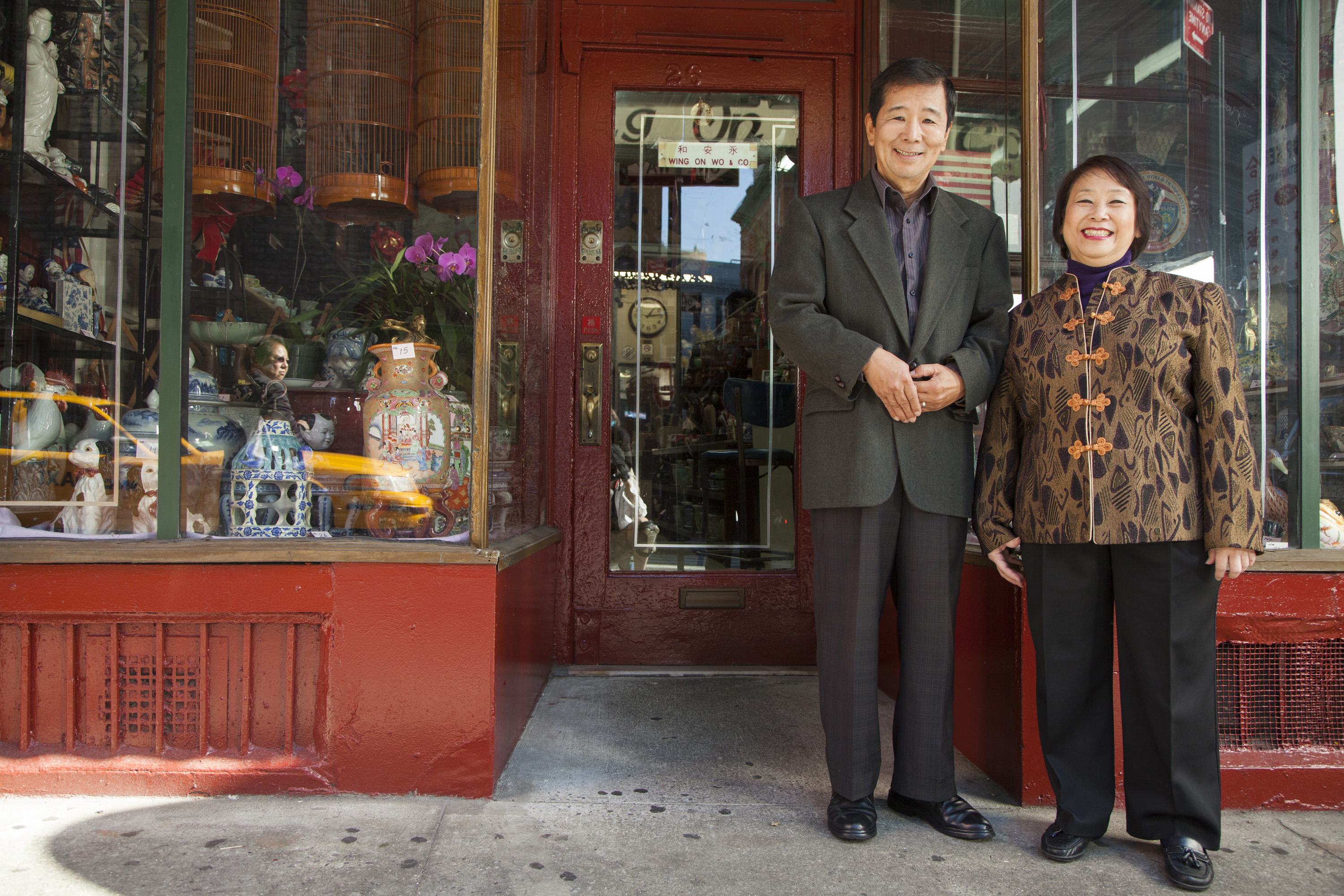 Asian family in front of store