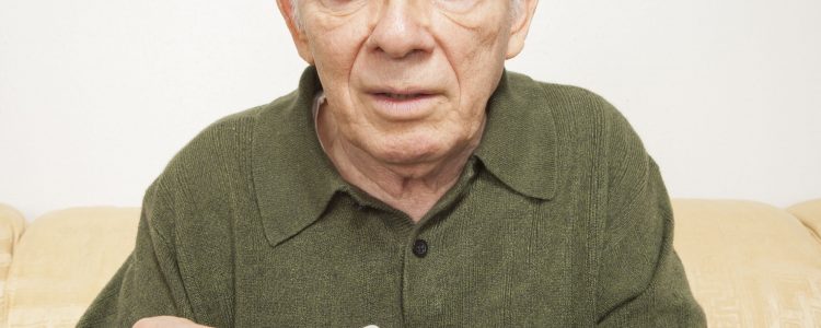 Senior man playing cards