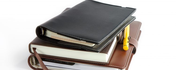 stack of ring binder book or notebook