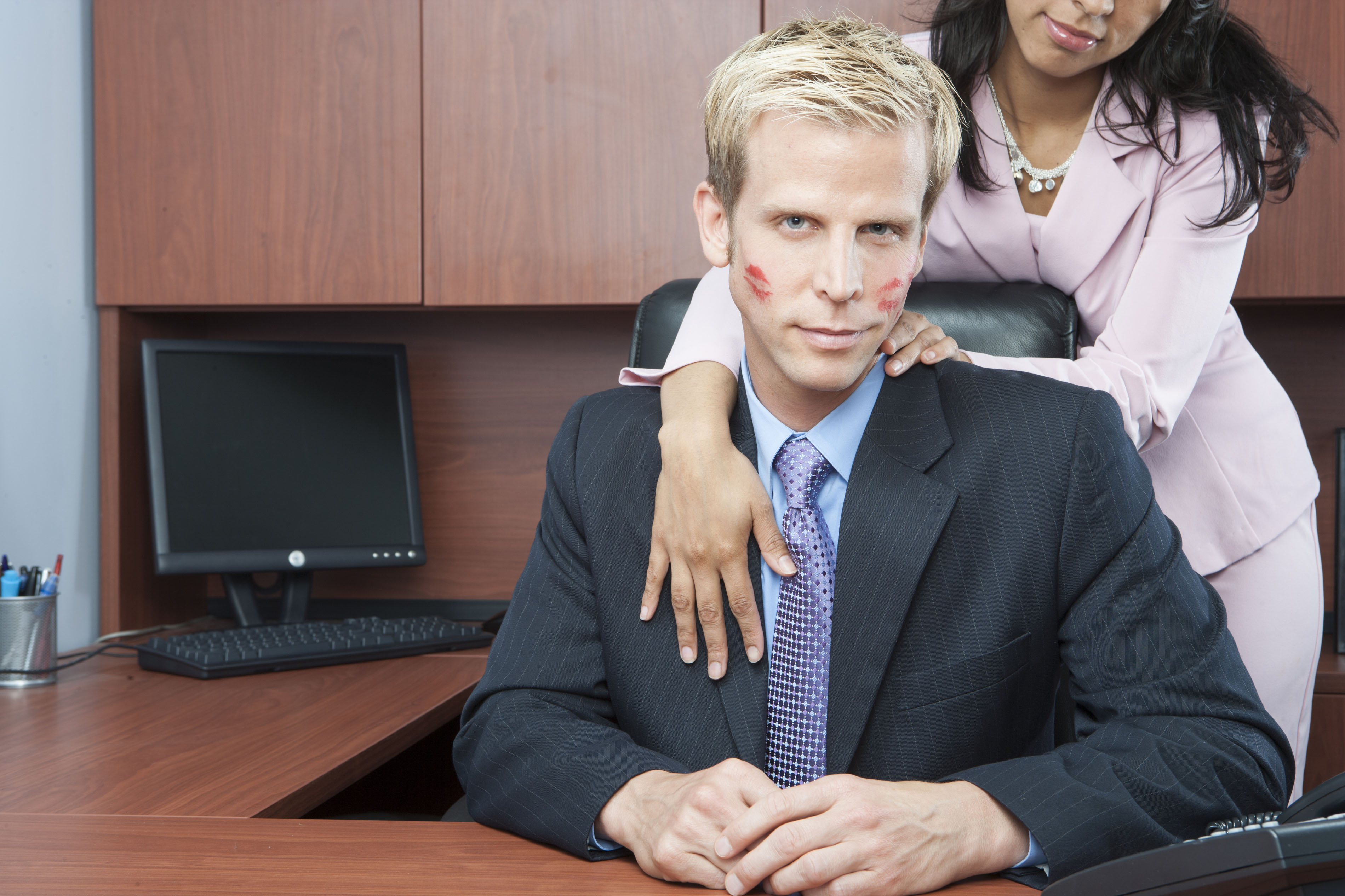 Woman seducing man in office