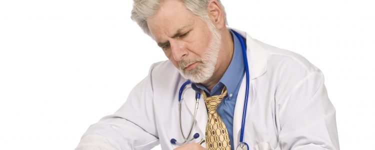 Doctor Completing Paperwork