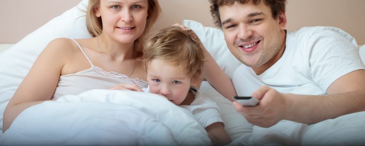 Happy family watching television