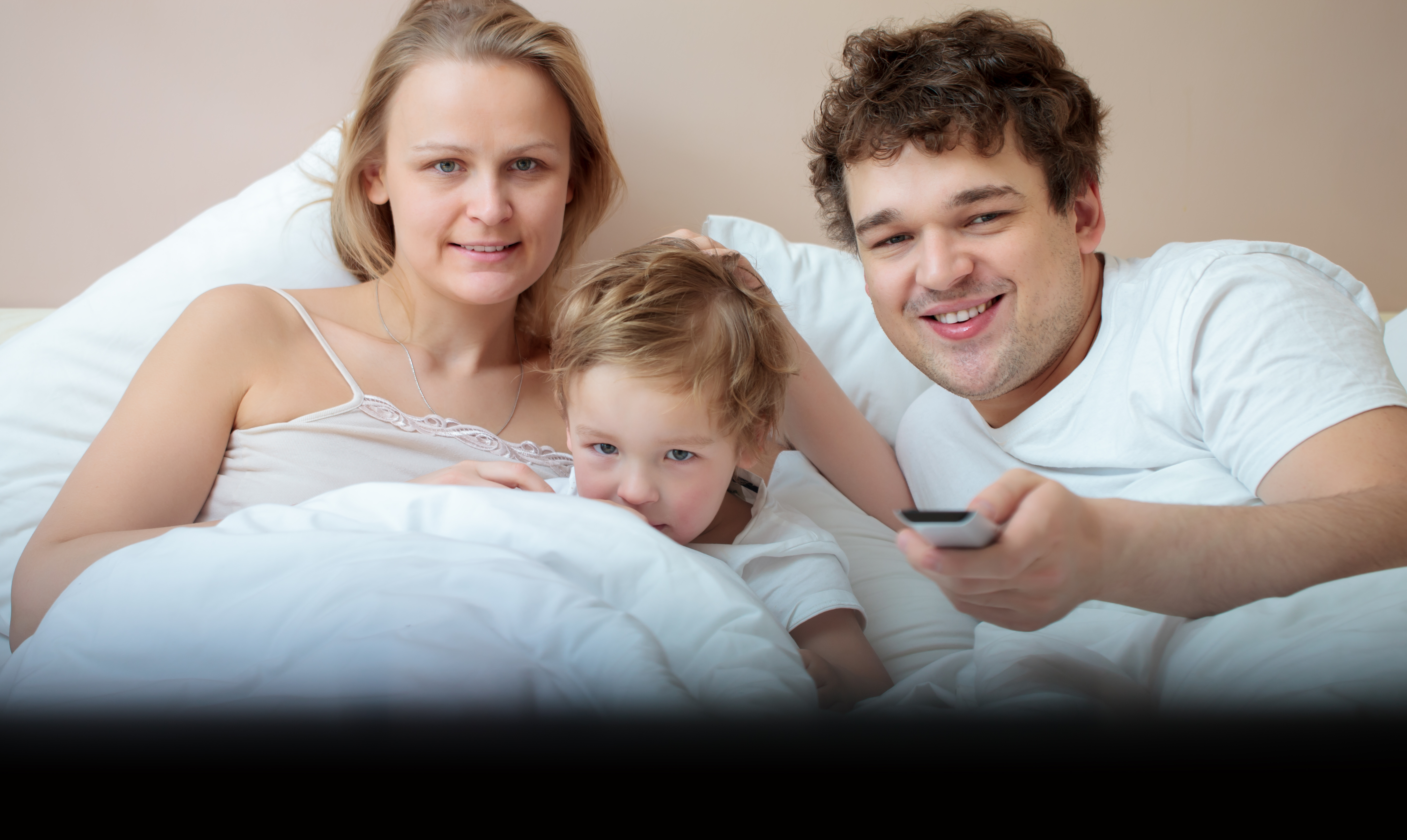 Happy family watching television